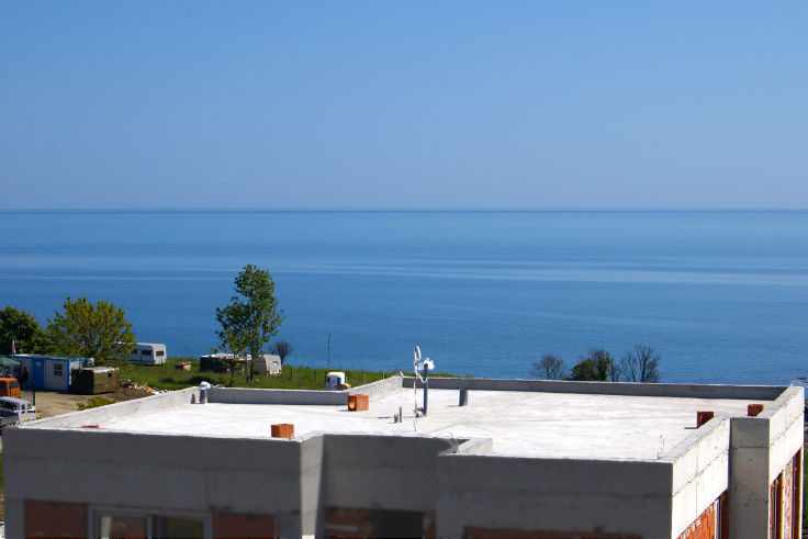 North east view from terrace of Villa Duo, the sea is 200m away, the beach is hidden. (May 2008, roof terrace of Villa Una not finished).